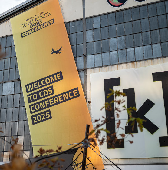 The building of Kampnagel with a poster of ContainerDays Conference 2025